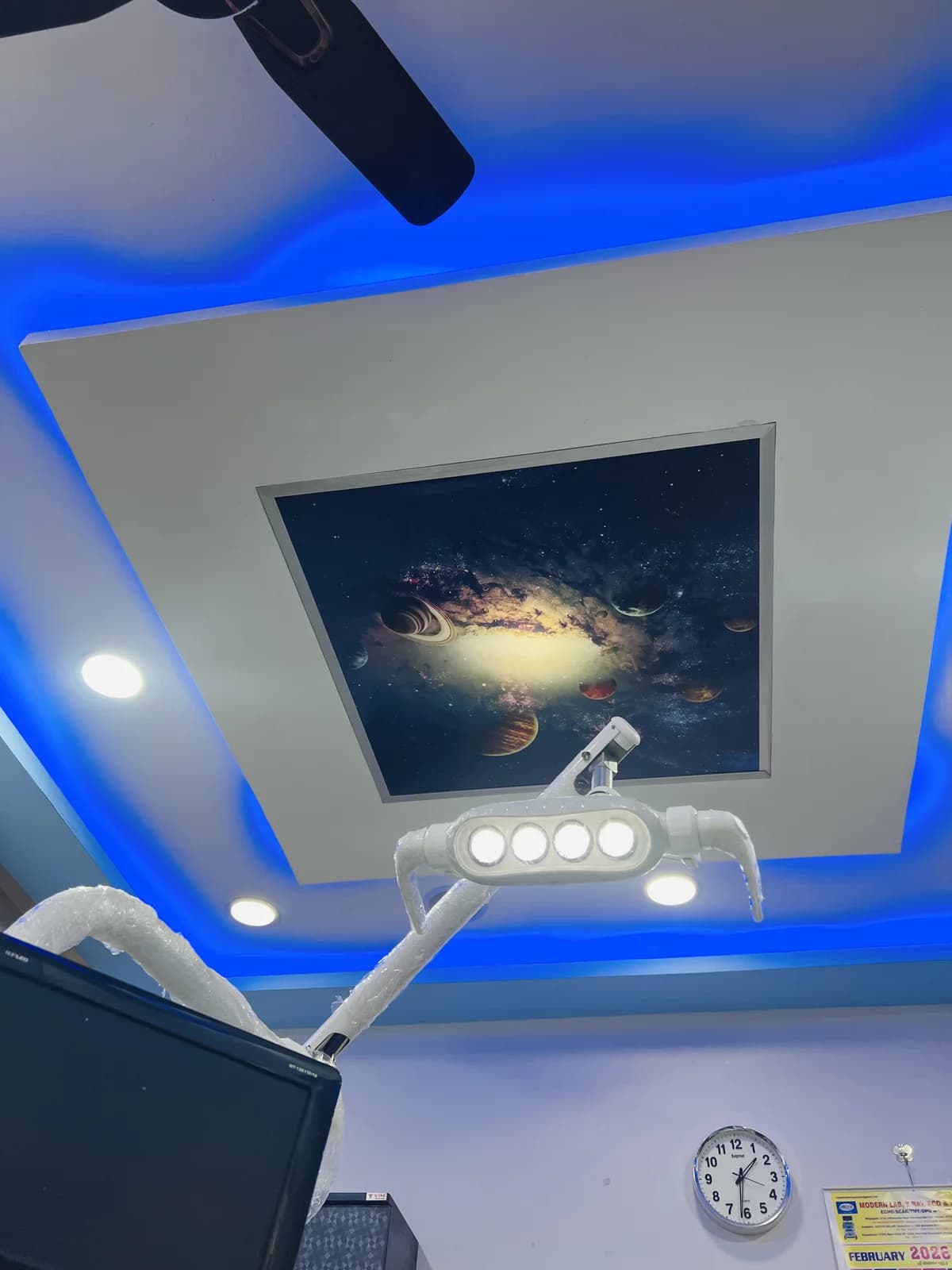 Treatment room with calming galaxy ceiling art